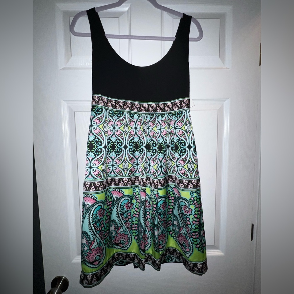 Dress with zip up back. Bottom of dress is a silk material. Size S.
